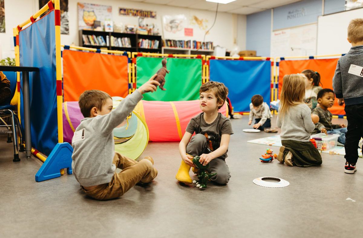Kids playing together in a classroom during a service.